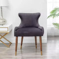 Poltrona da salotto contemporanea Okak Velvet con borchie, tappezzeria, cuscini spessi, elegante poltrona con gambe in legno massello per soggiorno e camera da letto