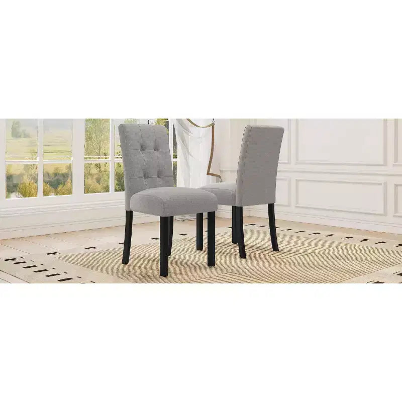 Set di 4 moderne sedie da pranzo trapuntate con gambe in legno di gomma e seduta imbottita
